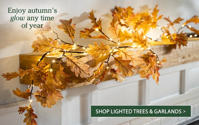Image of Lighted Mixed Leaf Fall Garland.  Enjoy autumns glow any time of year. SHOP LIGHTED TREES & GARLANDS
