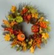 Wreath with pumpkins and fall leaves