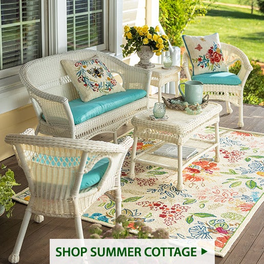Image of Easy Care Wicker, Flower Field Rug, Flutter Pillows. Shop Cottage Charm