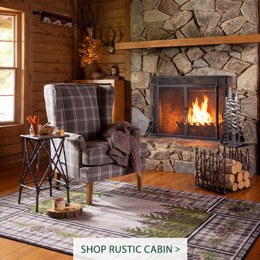 Image of Plaid Wingback Chair, Pine Cone Valley Rug, Branch Wood Rack. Shop Rustic Cabin