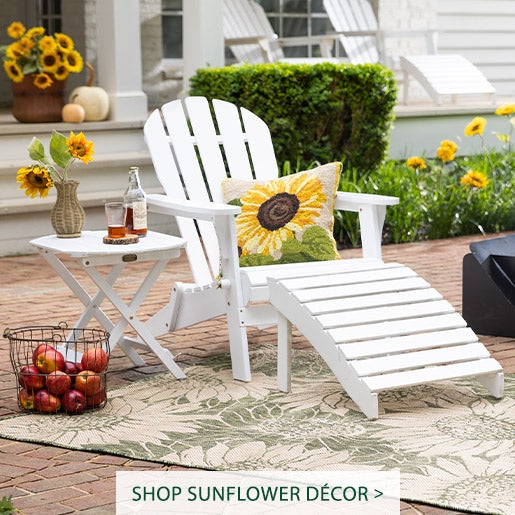 Image of White Adirondack Chair with Sunflower Pillow and Sunflower Rug.  Sunflower Décor