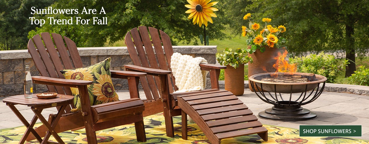 Sunflowers Are A Top Trend for Fall image of adirondack furniture with sunflower rug and sunflower stake on patio