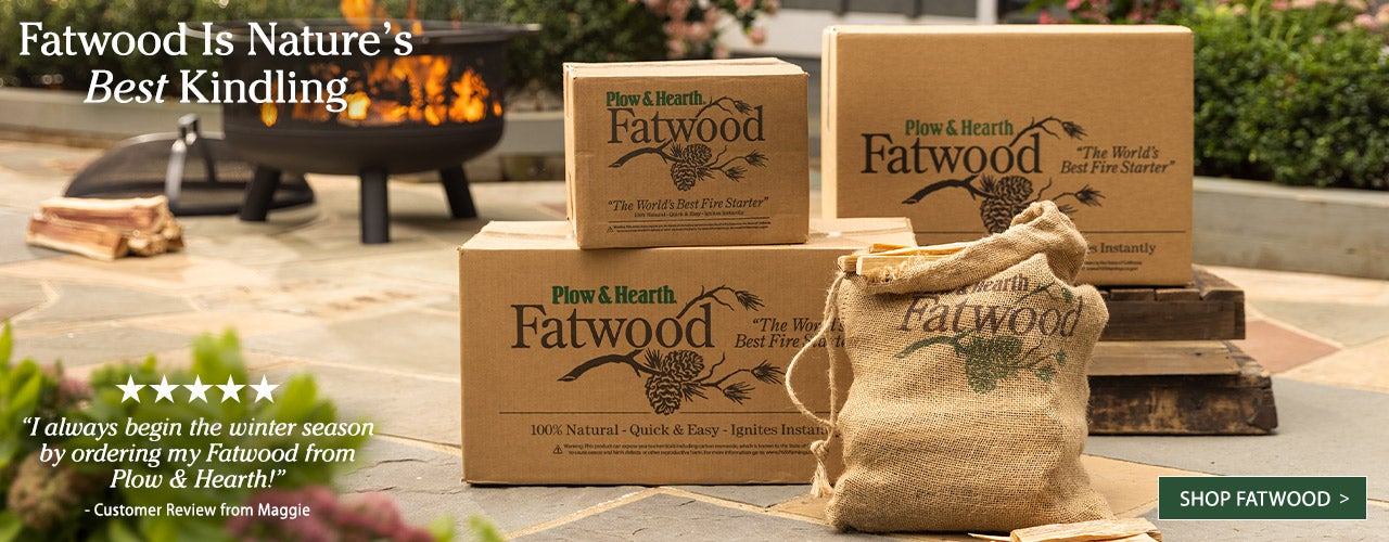 Boxes of fatwood kindling sit beside a blazing firepit. Fatwood is nature's best kindling. Shop Fatwood.