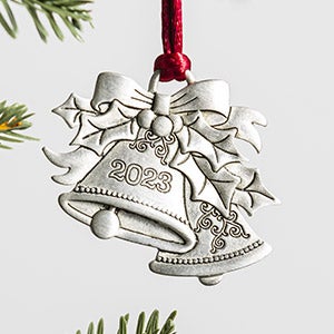 A collection of pewter keepsake ornaments on a tree