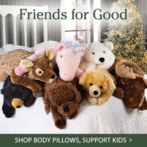 A stack of plush animal body pillows on a bed. Friends for Good. SHOP BODY PILLOWS, SUPPORT KIDS
