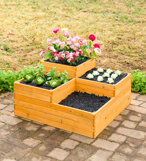 Image of a wooden four-cube raised garden bed planter with vegetables and flowers. Shop Raised Garden Beds