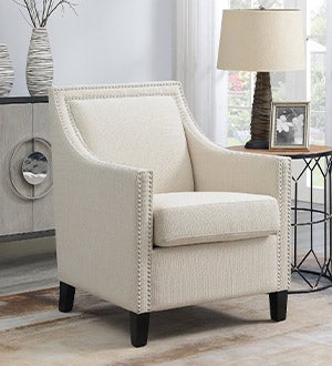 Beige colored Lillie upholstered accent chair in a living room setting.