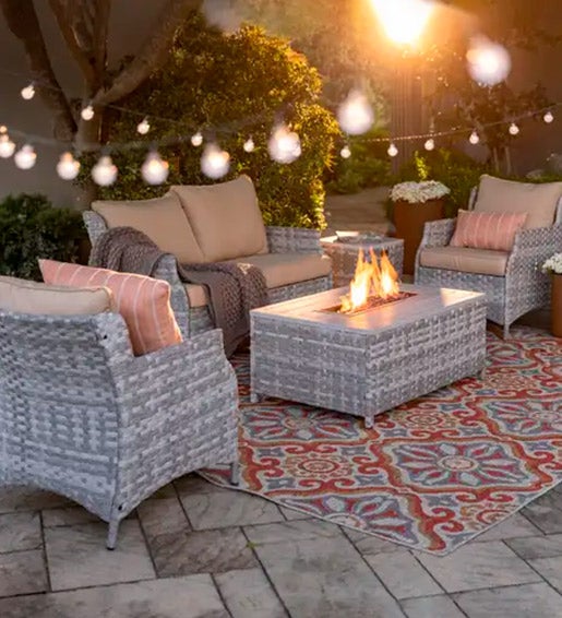 WICKER FURNITURE > Image of a gray wicker St. Helena wicker patio seating set with fire pit table. 