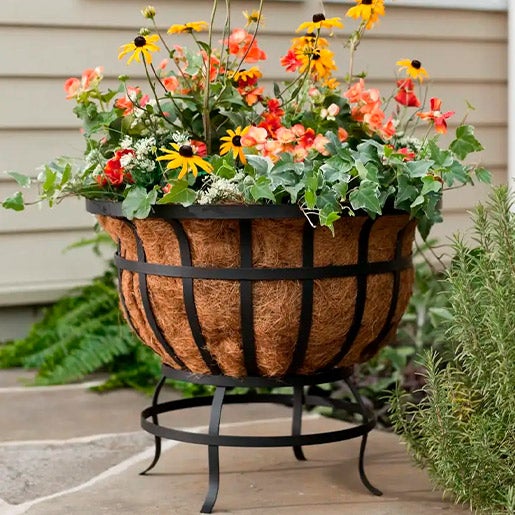 Footed metal basket planter with coco liner
