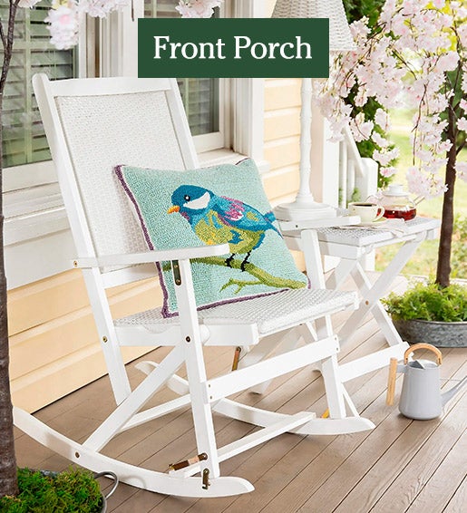 Image of White Rocker with Bird Pillow. Front Porch