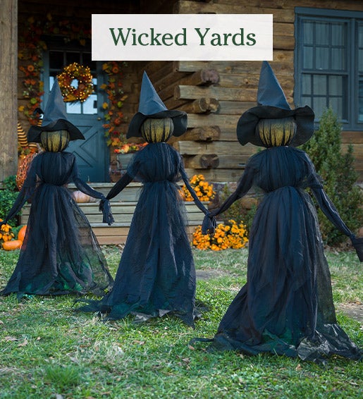 Image of Lighted Halloween Witch Stakes in front yard. Wicked Yards