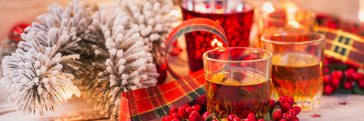 glasses of liquor with christmas decorations