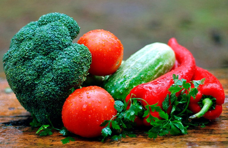 fruits and vegetables on cutting board