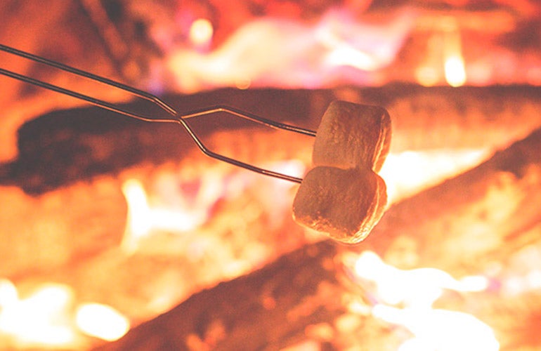 roasting marshmellow in fire pit