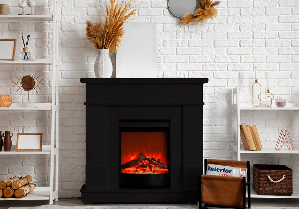 black fireplace against white wall
