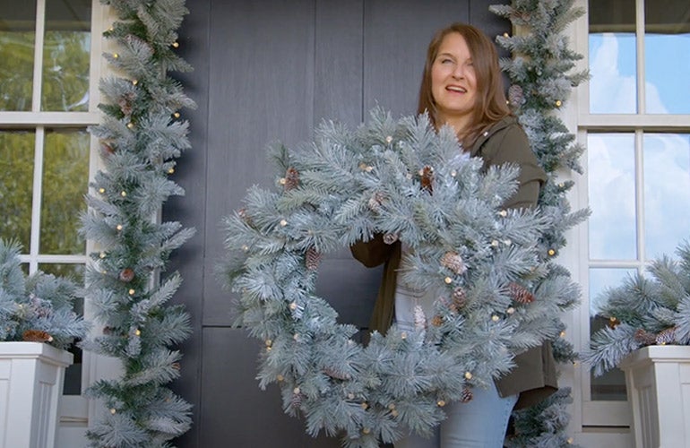 woman holding wreath