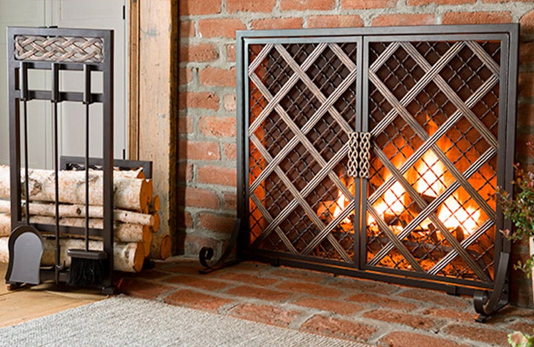 lit hearth with fireplace tools