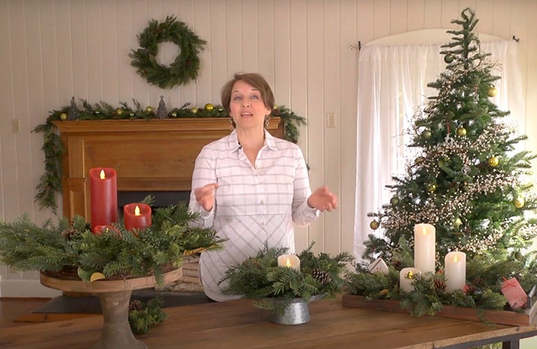 woman at table with holiday decorations