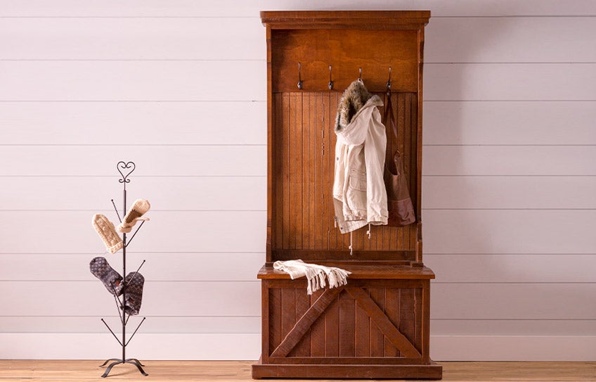 A Bowling Green hall tree in a deep brown wood finish with storage bench and coat hooks.