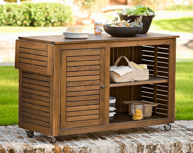 Lancaster eucalyptus wood outdoor storage cart with wheels and shelves.