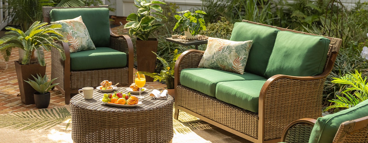 wicker patio furniture with green cushions