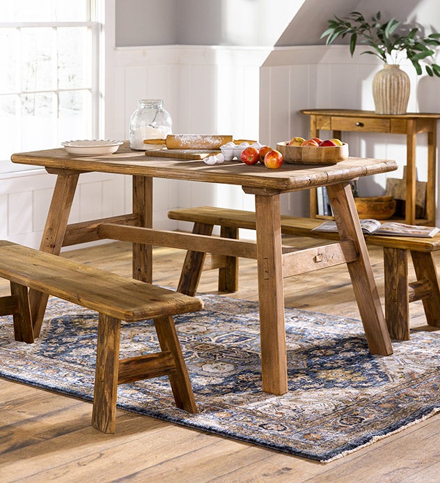 A Rowan Ridge rustic family room coffee table and side table made of reclaimed fence post wood in a warm honey finish